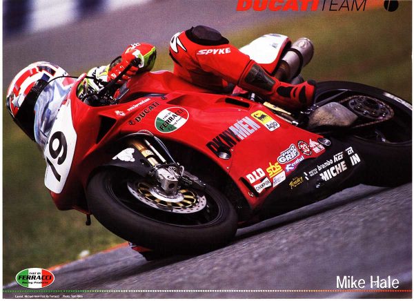 Tom Riles original 1999 Ducati Team motorcycle racing poster; Mike Hale leaning motorcycle in red Ducati team livery, dynamic action composition, vibrant color offset-lithograph, unbacked condition.