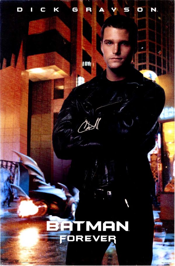 "Original 1997 Batman Forever theatrical poster hand-signed by Chris O'Donnell in silver ink; actor in black leather jacket posed against illuminated city street backdrop—offset-lithograph, vibrant color palette, 1990s superhero cinema promotional art"