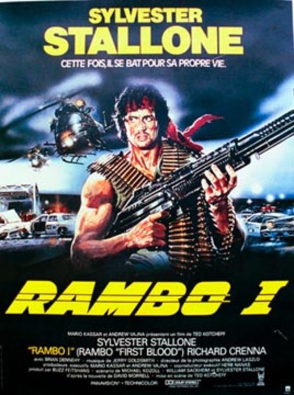 1982 Rambo (First Blood) French grande poster, artist unknown, featuring Sylvester Stallone holding a large machine gun with police cars and a helicopter in a nighttime scene.