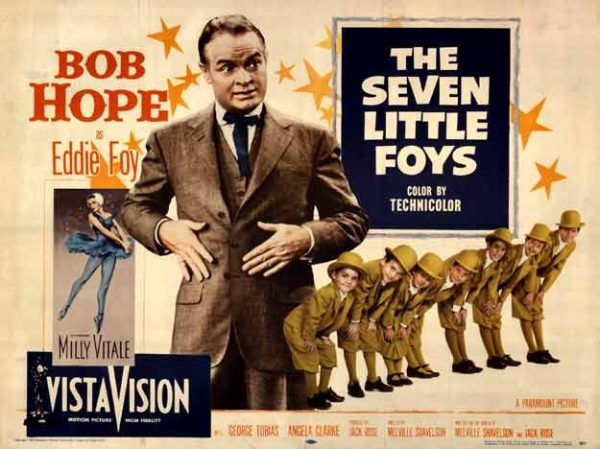 1955 VistaVision poster for The Seven Little Foys, artist unknown, featuring Bob Hope in a suit with seven identical children marching beside him, rendered in bright mid-century colors with bold typography.