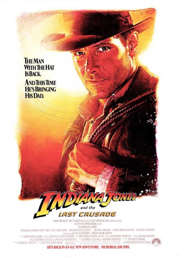 Original, 1989 U.S. one-sheet Indiana Jones and the Last Crusade advance poster featuring a close-up portrait of Harrison Ford in fedora with warm-toned background and tagline text.