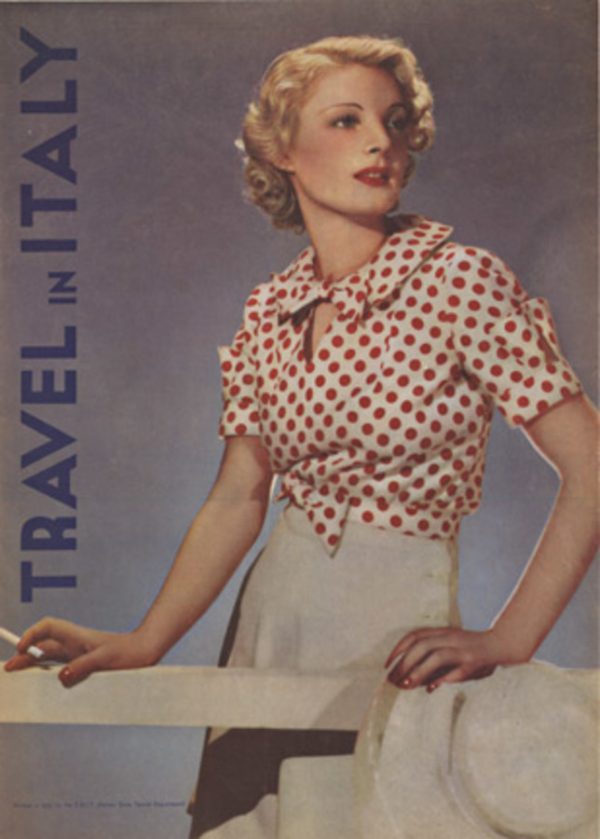 1930s ENIT travel poster featuring a seated woman in a red polka-dot blouse holding a cigarette, with vertical “Travel in Italy” text along the side.