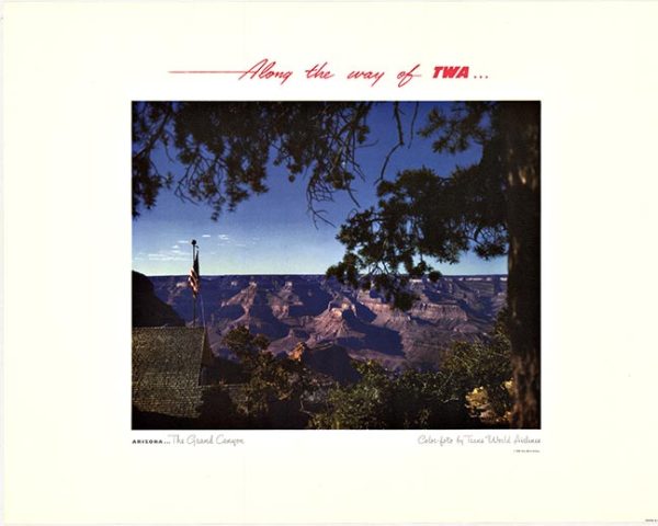 photograph of the Grand Canyon at sunset with an American flag on a pole in the foreground and tree branches framing the scene, with text above and below.