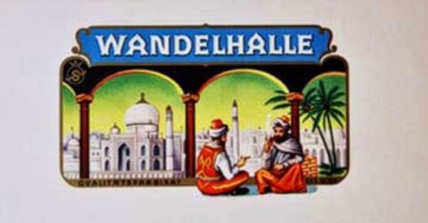 Vintage Wandelhalle Arabs cigar label featuring blue header band with white text, two rounded arch frames showing white domed mosque architecture with tropical palms on left, two turbaned Arab figures in colorful dress reclining in paradise garden on right, ornamental gold borders, 9.75 x 5.5 inches.