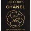 Les Codes de CHANEL black and gold ink poster, interlocking CHANEL words with gold ink rose on dark background, archival linen backed