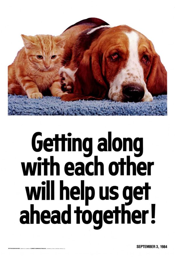 Original 1984 Better-Work motivational workplace poster; close-up of orange tabby cat and reddish-brown dog sharing blue towel with faces in profile suggesting teamwork and cooperation, bold black typography reading "Getting along with each other will help us get ahead together!"—1980s corporate motivational design, linen-backed