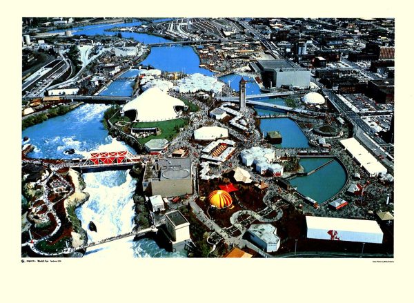 Mike Roberts original 1974 aerial photograph lithograph of Expo '74 World's Fair, Spokane, Washington; vibrant bird's-eye view showing fairgrounds, water features, and exhibition pavilions—photo lithography, bold mid-century color palette, World's Fair documentation photography