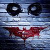 Original 2007 Dark Knight pre-release movie poster; stenciled black Joker silhouette face with menacing red smile bleeding down weathered blue brick background—dual-sided design, vibrant color, B-B+ condition—Heath Ledger iconic imagery, street art aesthetic"